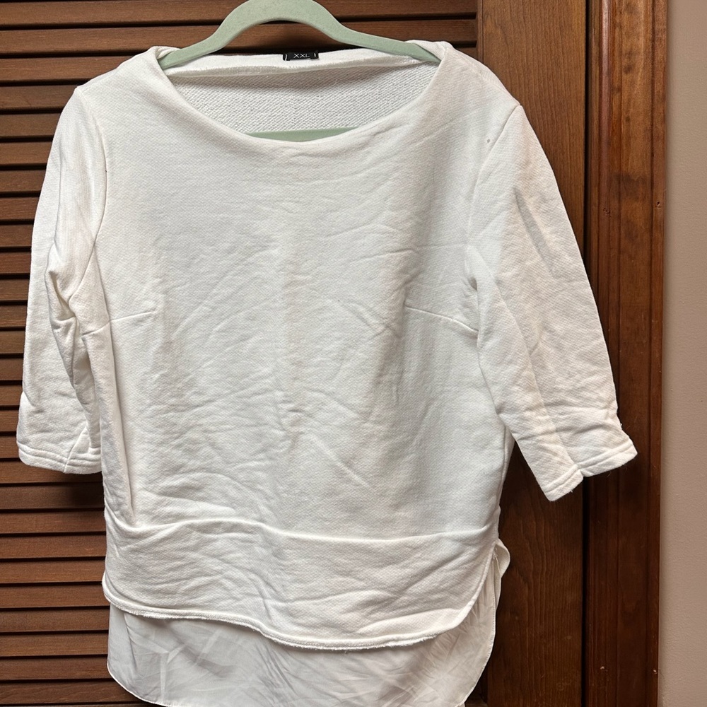 White hi-low pull over.